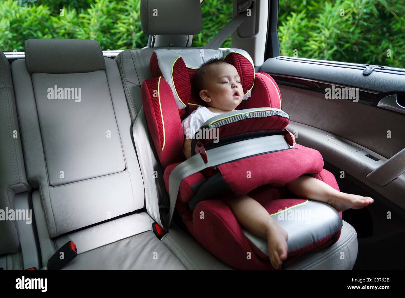 Baby girl asleep in car seat Stock Photo Alamy