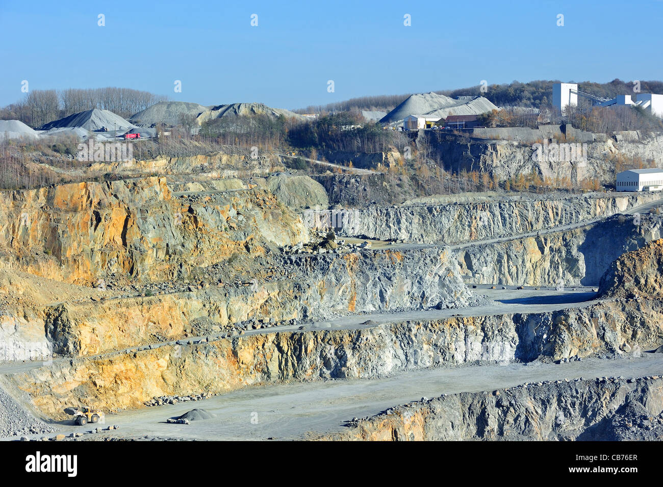Platforms at porphyry quarry, open-pit mine for the production of gravel for road building at Lessen / Lessines, Belgium Stock Photo