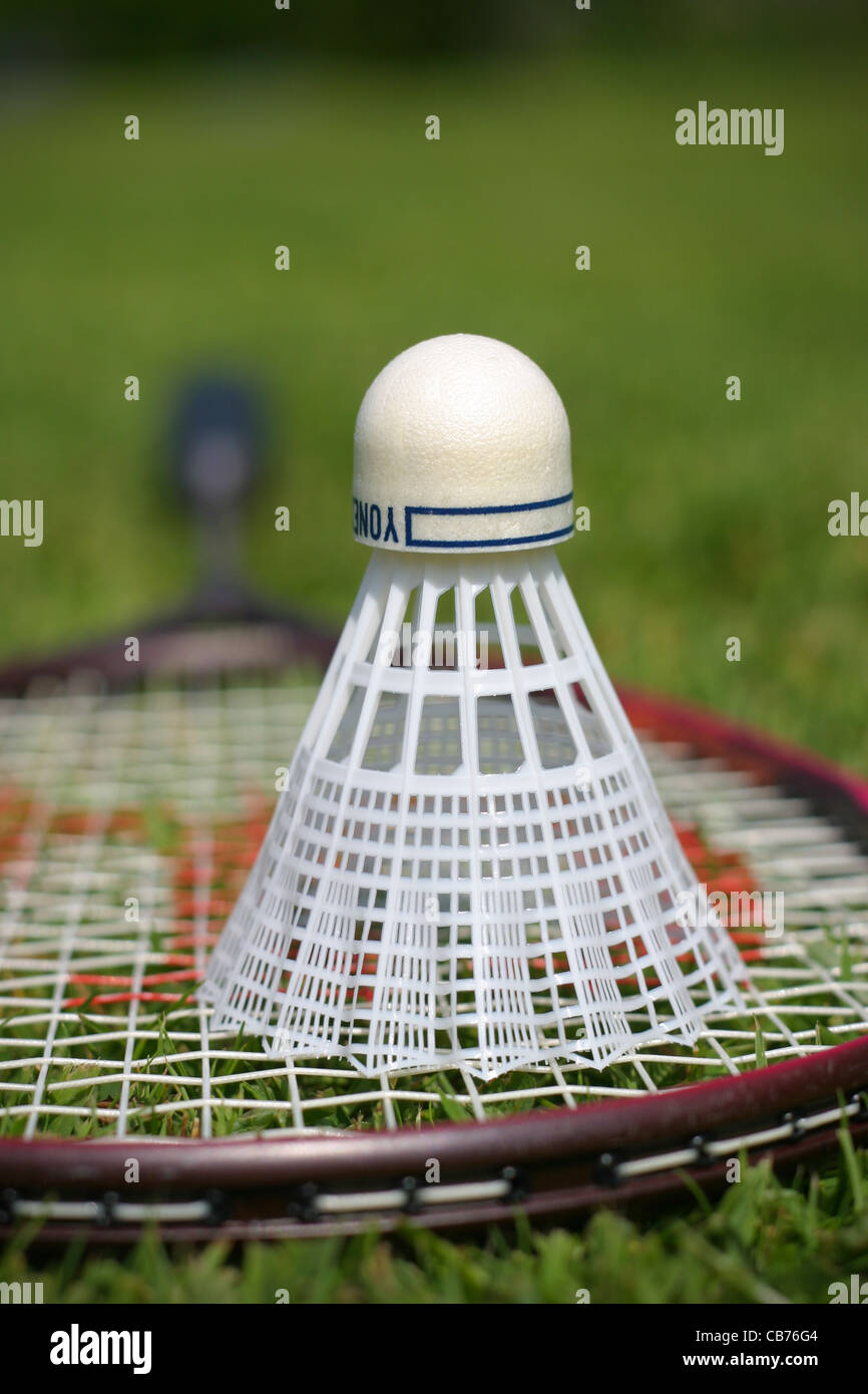 Close-up Shot of a Shuttlecock on the Badminton Racket · Free Stock Photo
