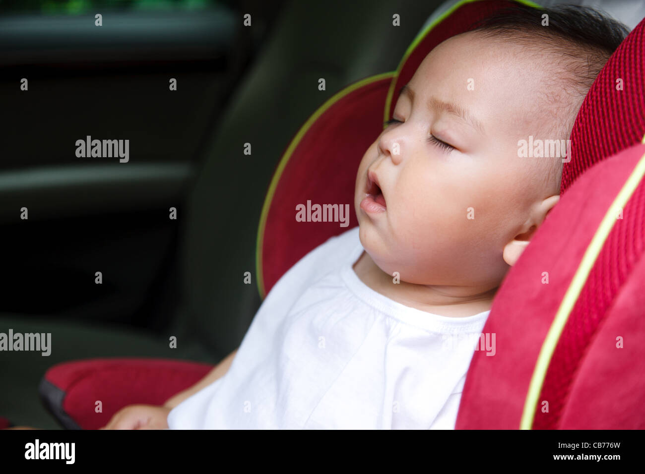 Baby girl asleep in car seat Stock Photo Alamy