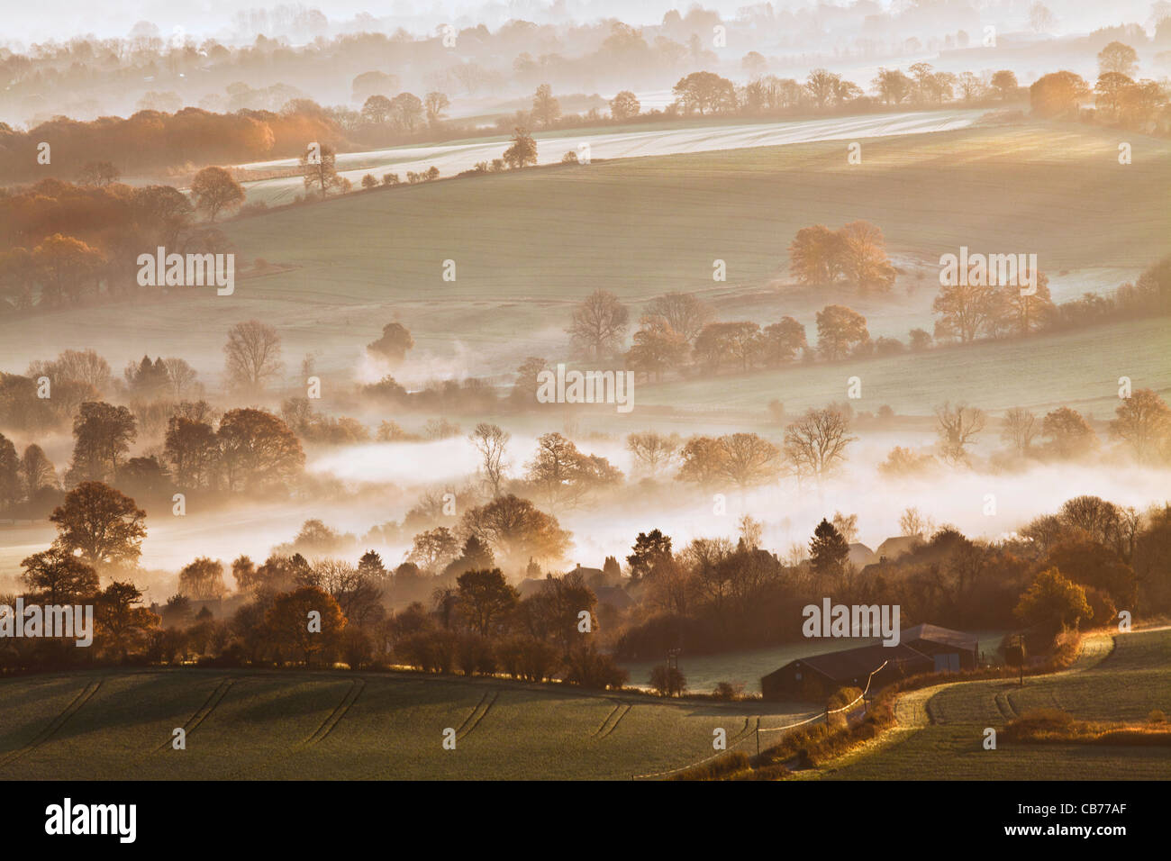 A winter sunrise view from Martinsell Hill over the Vale of Pewsey in Wiltshire, England, UK Stock Photo