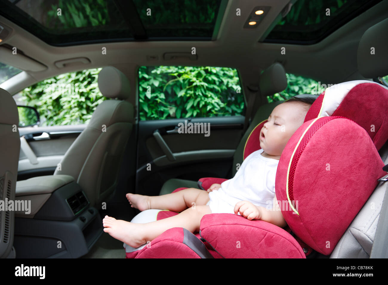 Baby girl asleep in car seat Stock Photo Alamy
