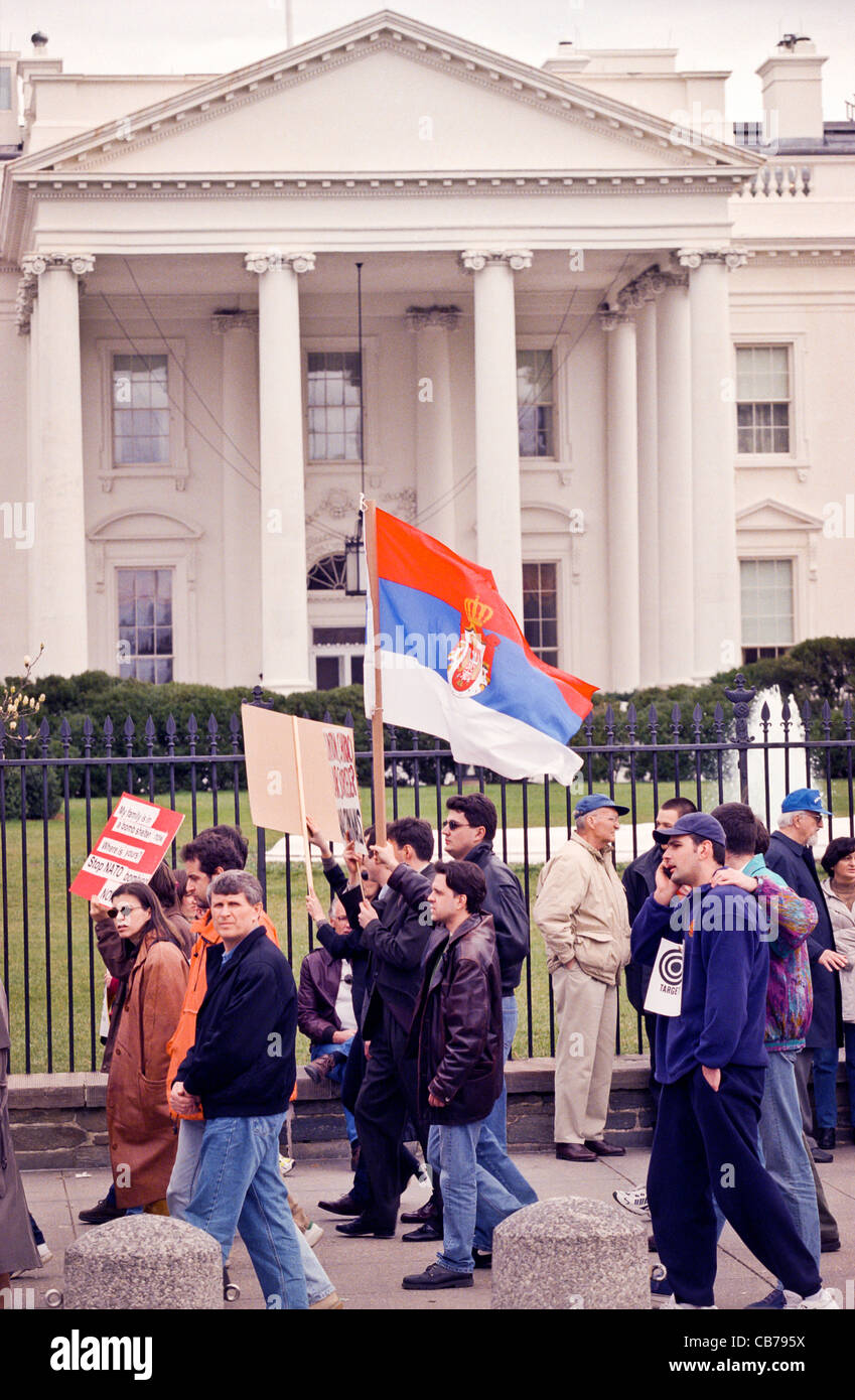Serbs Yugoslavia bombing Serbia Serbian Kosovo NATO protest protesters demonstration demonstrators rally war military intervention US USA Washington DC White House America outdoors looks away politics portrait day flags signs vertical Stock Photo