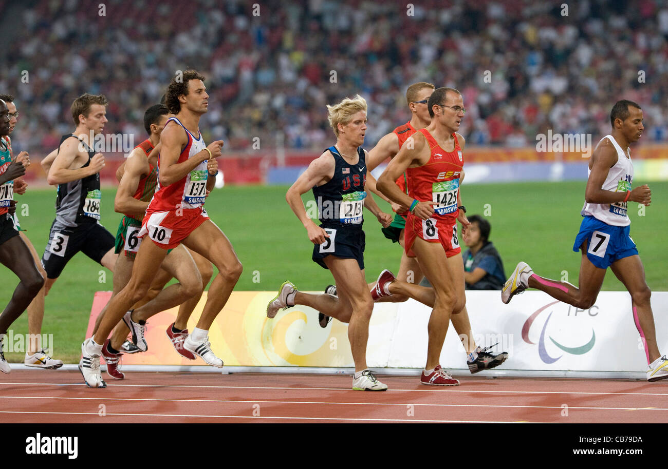 athletic competition at the 2008 Paralympic Games showing blind runners during 800 meters men's race Stock Photo