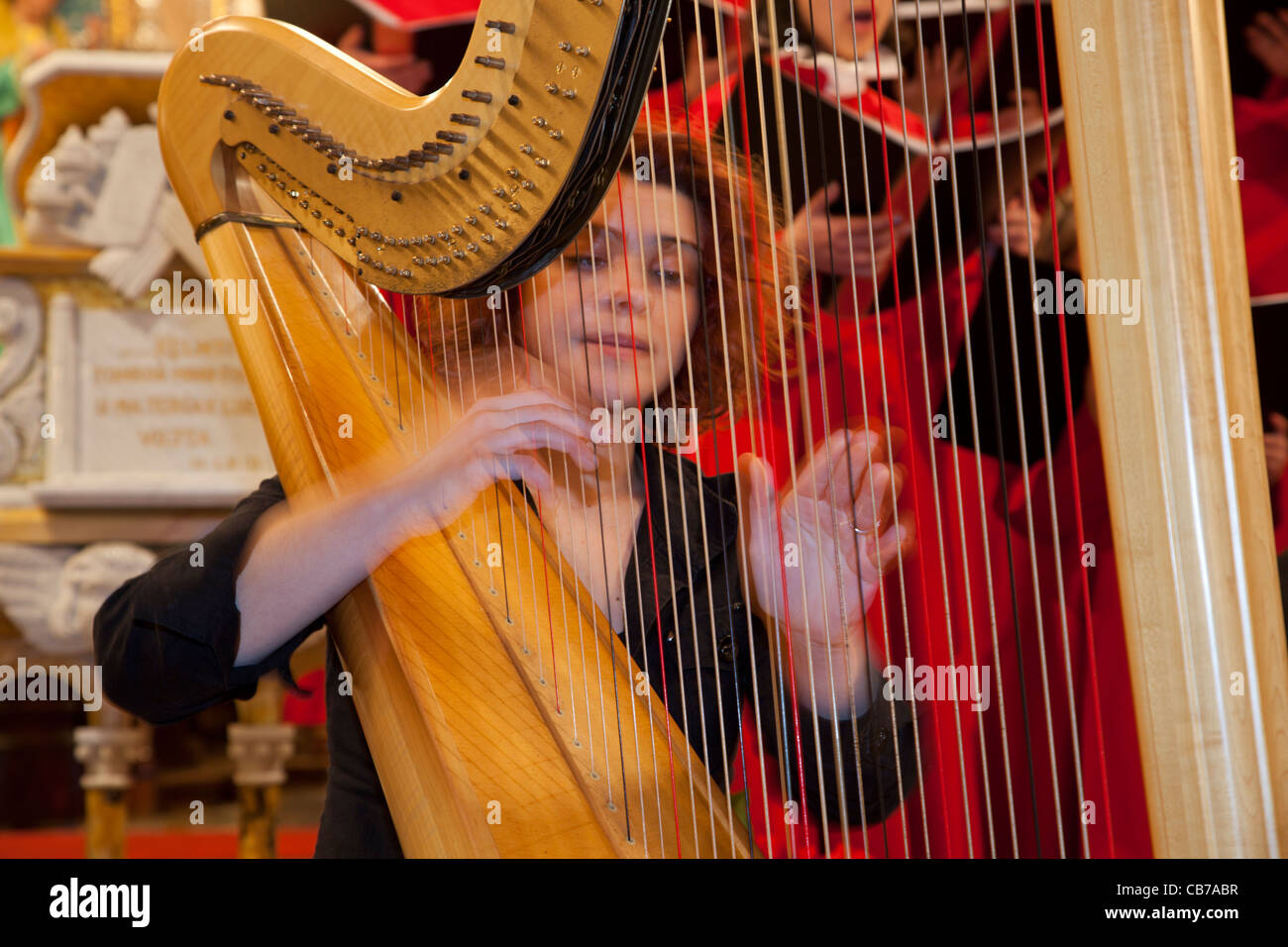 An orchestra performing during Christmas festivities in the church of Xaghra town in Gozo in Malta. Stock Photo