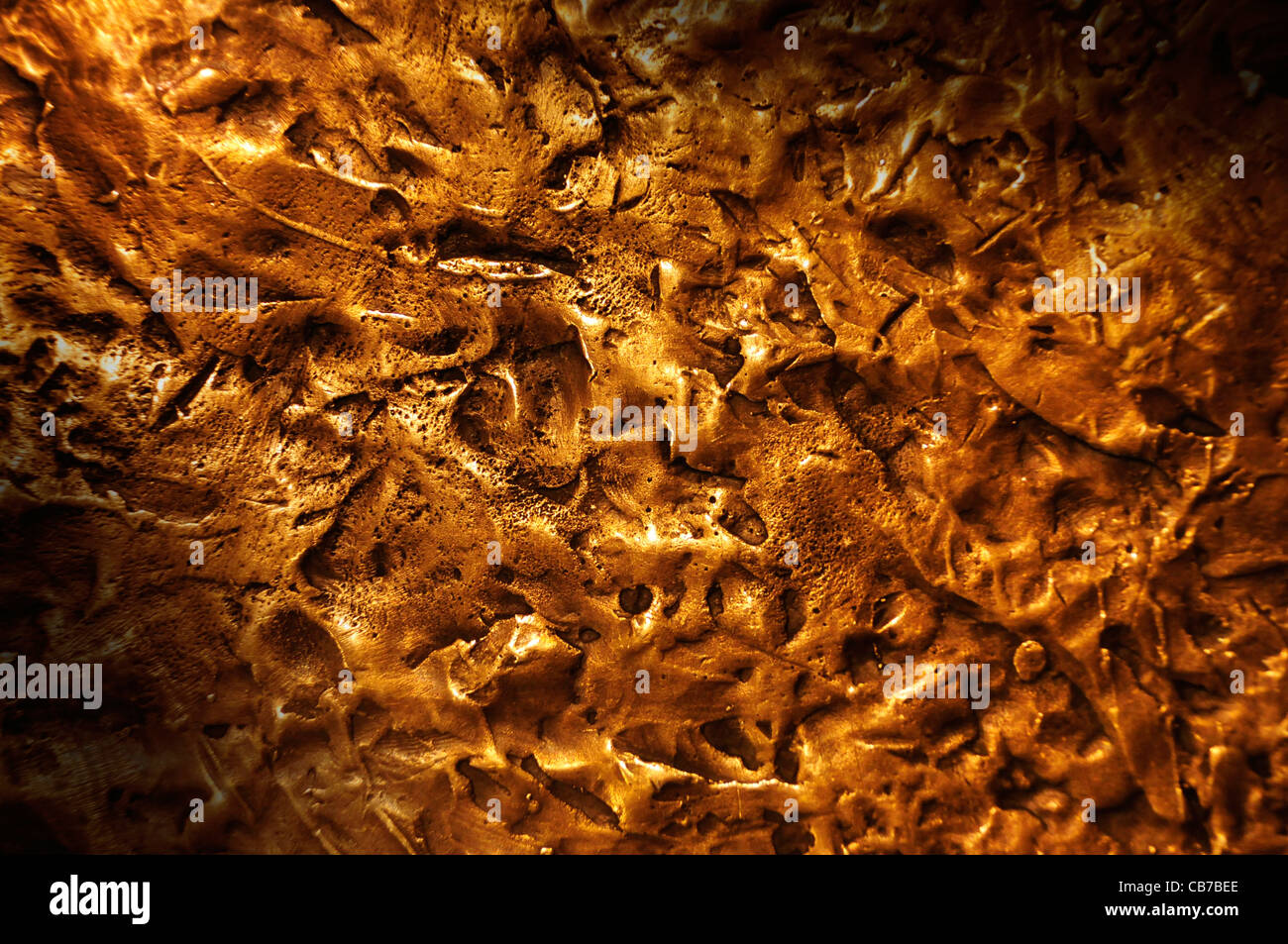 Close-up on a bronze surface texture lit diagonally Stock Photo