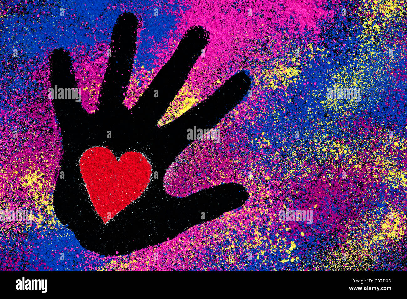 Childs hand prints with red heart shapes made with coloured powder on a black background Stock Photo