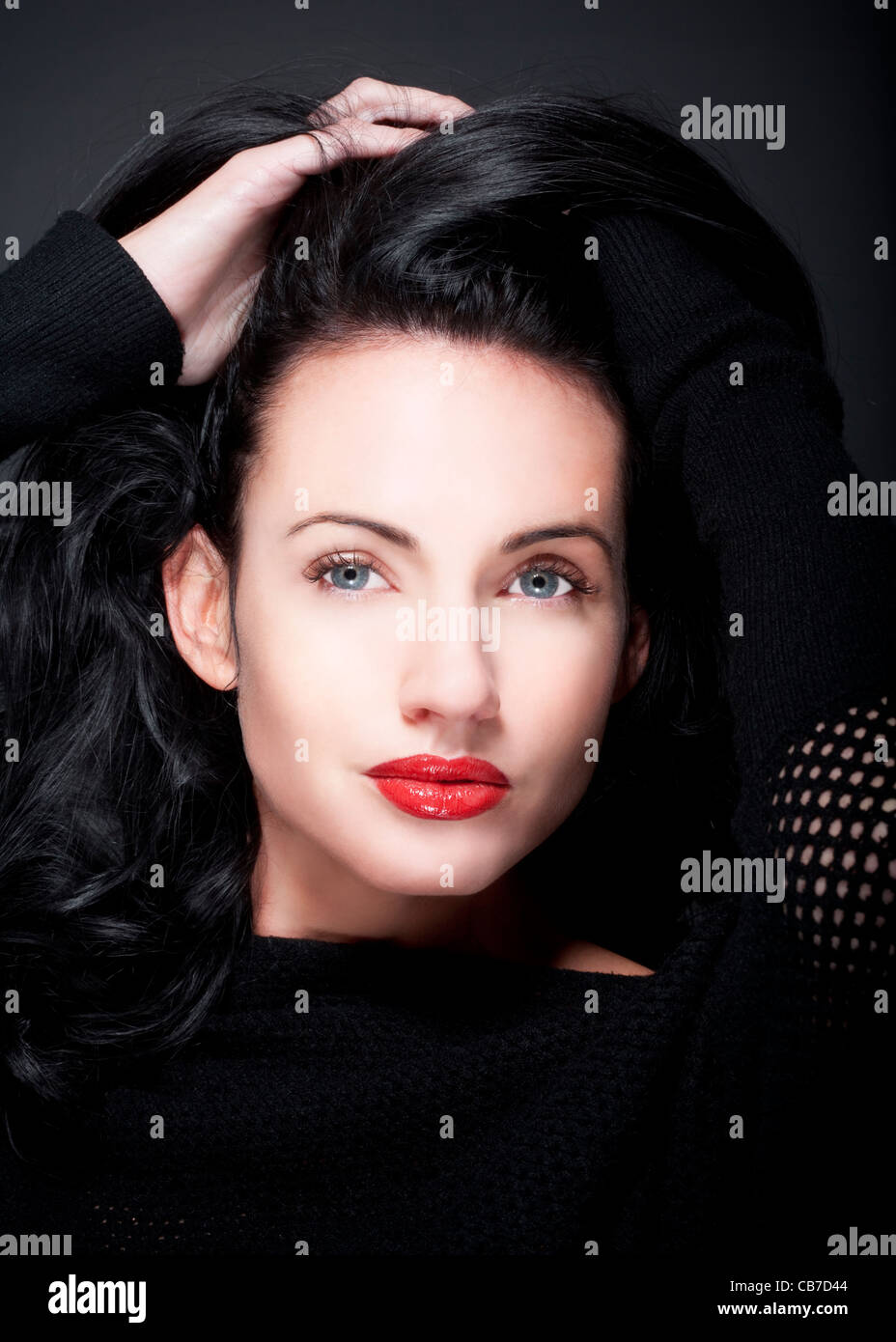 portrait of beautiful woman with dark hair and blue eyes Stock Photo ...