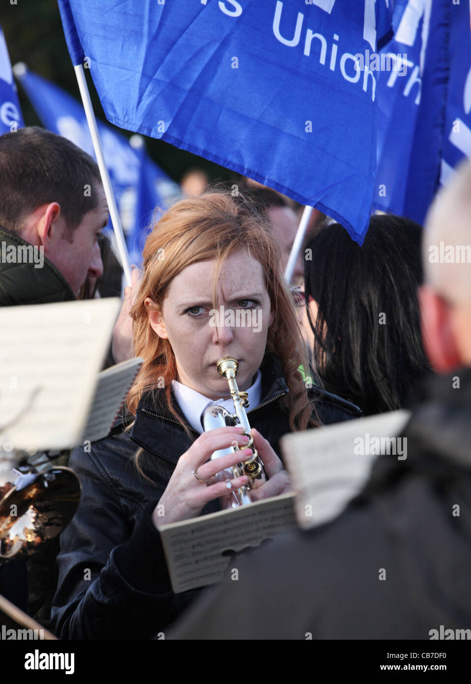 Young woman playing in brass band supporting TUC day of action
