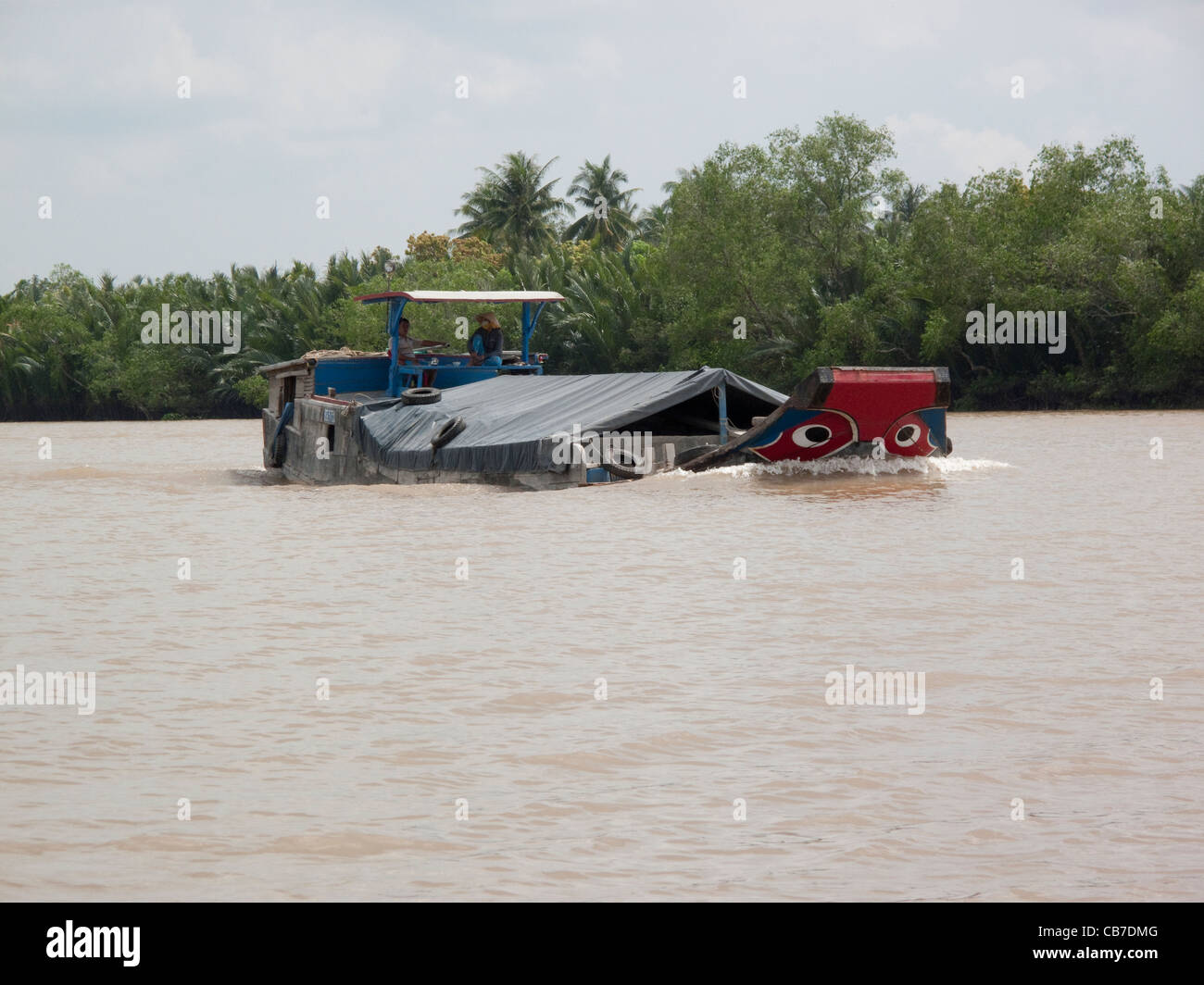 River cargo boat on the River Mekong, Mekong Delta, Vietnam Stock Photo