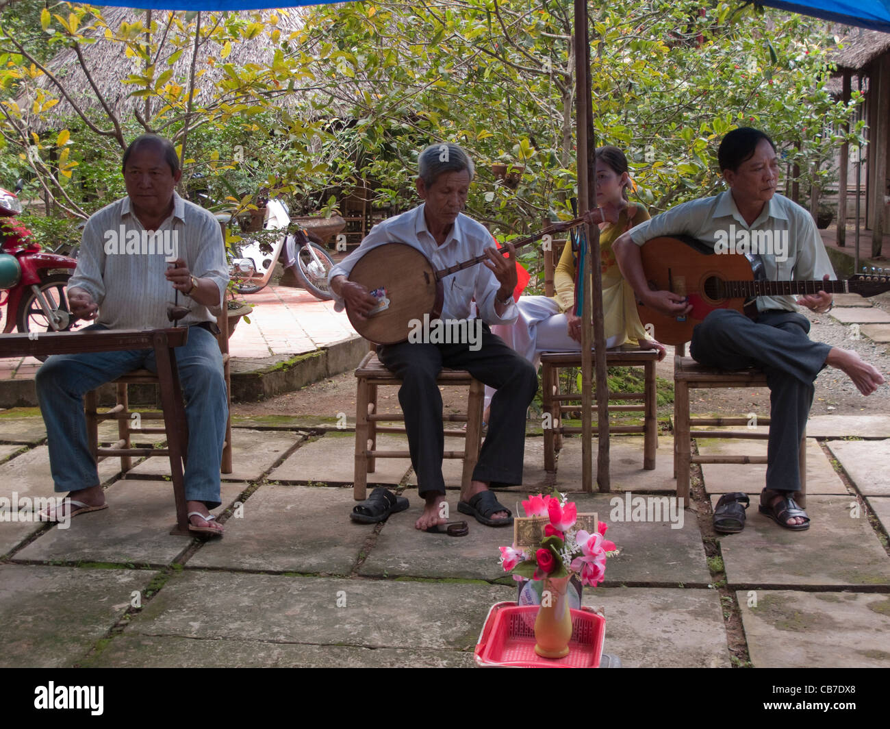 Musicians playing at Mekong Delta village in Vietnam Stock Photo