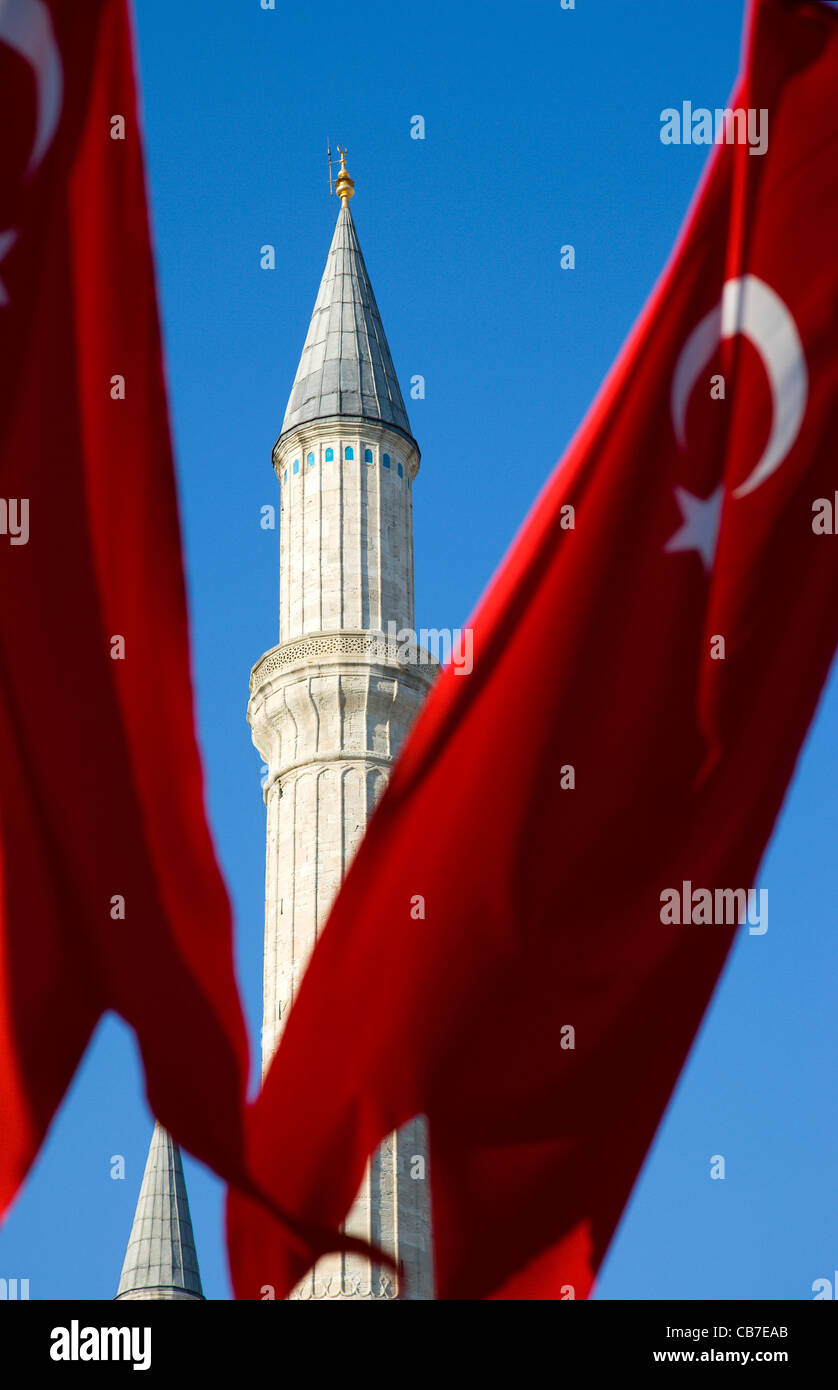 Turkey, Istanbul, Sultanahmet, Haghia Sophia minaret and Turkish red flag with white crescent moon and star. Stock Photo