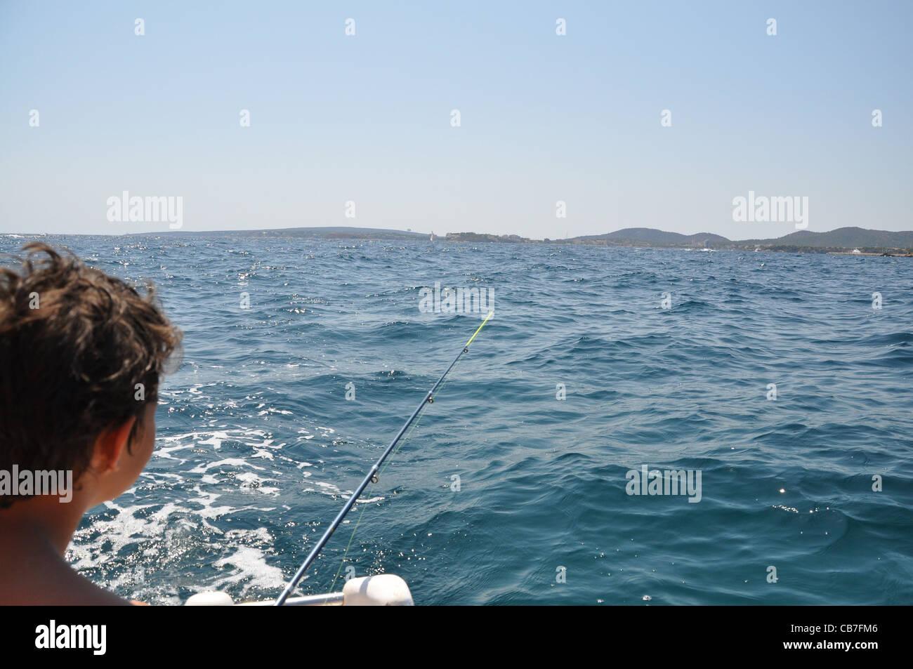 Boy fishing boat hi-res stock photography and images - Alamy