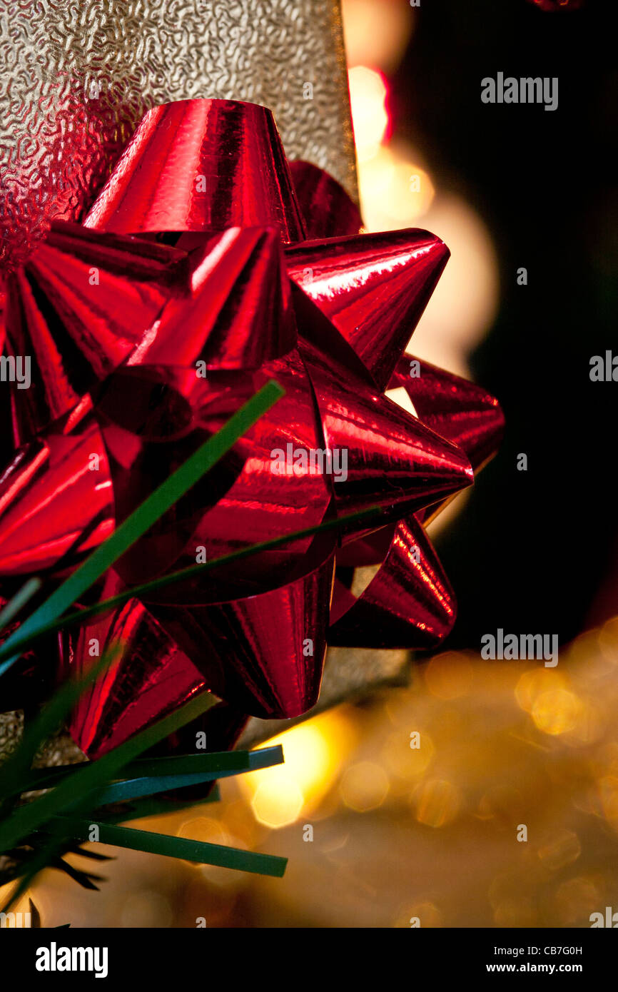 gift on Christmas tree.bright color.upright format. Stock Photo