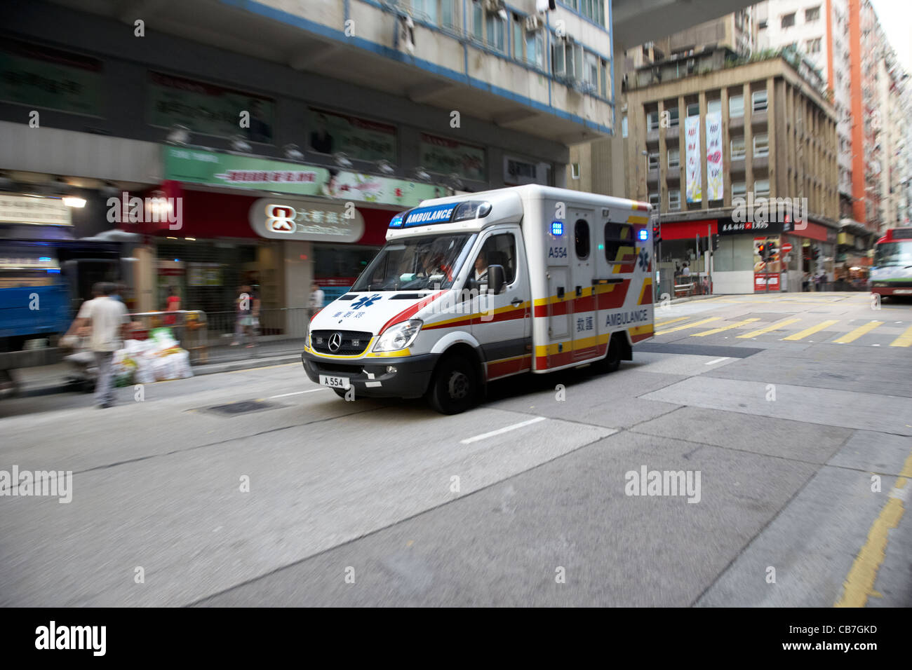ambulance speeding through the streets of western district hong kong