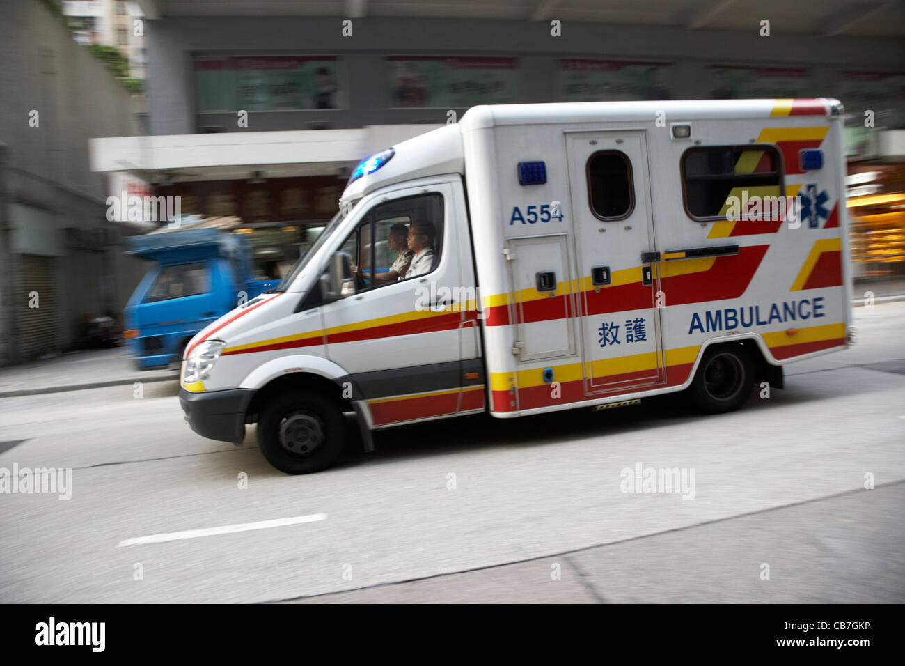 ambulance speeding through the streets of western district hong kong island, hksar, china Stock Photo
