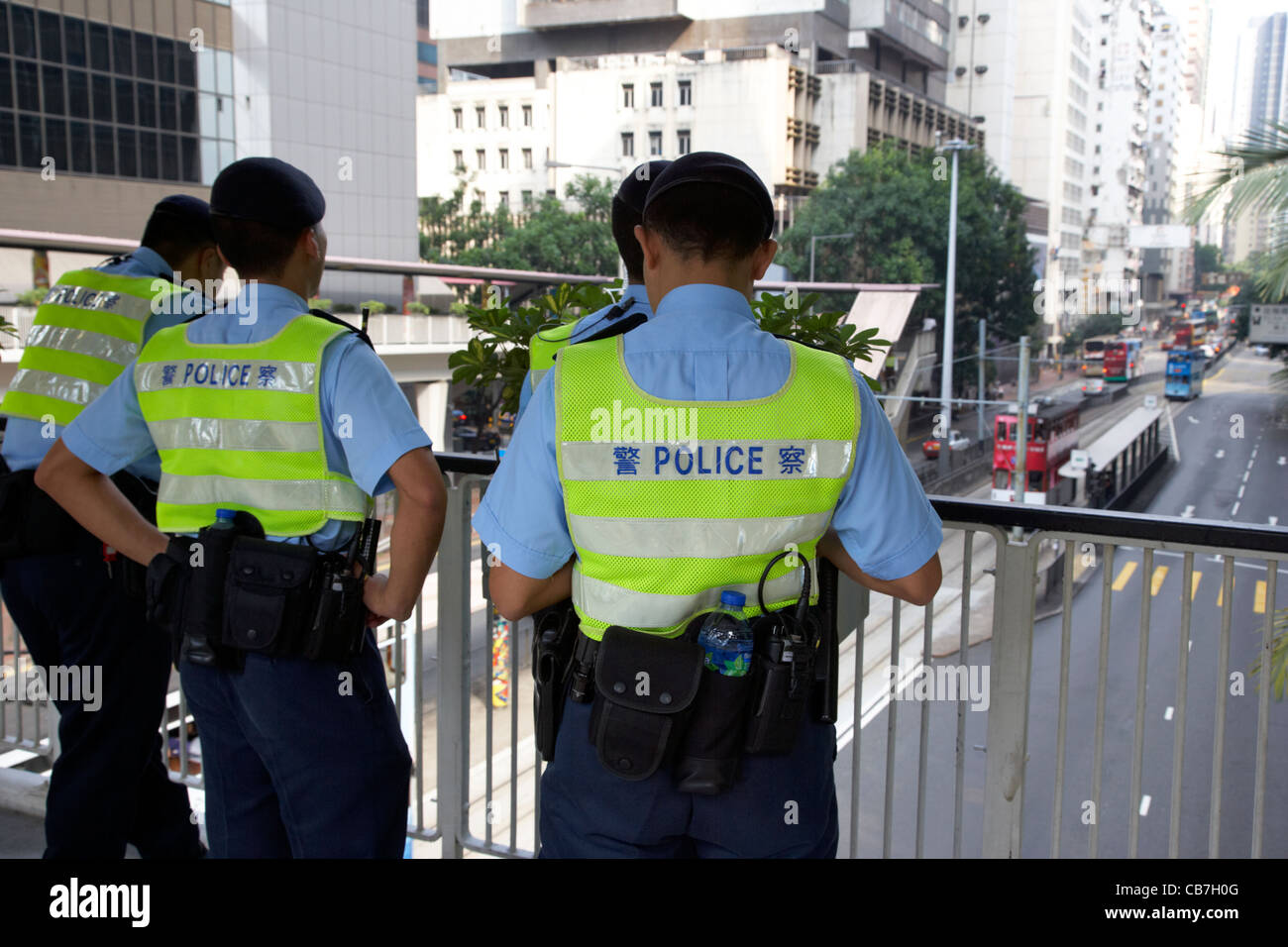 hong kong police officers on overhead walkway hong kong island, hksar, china Stock Photo