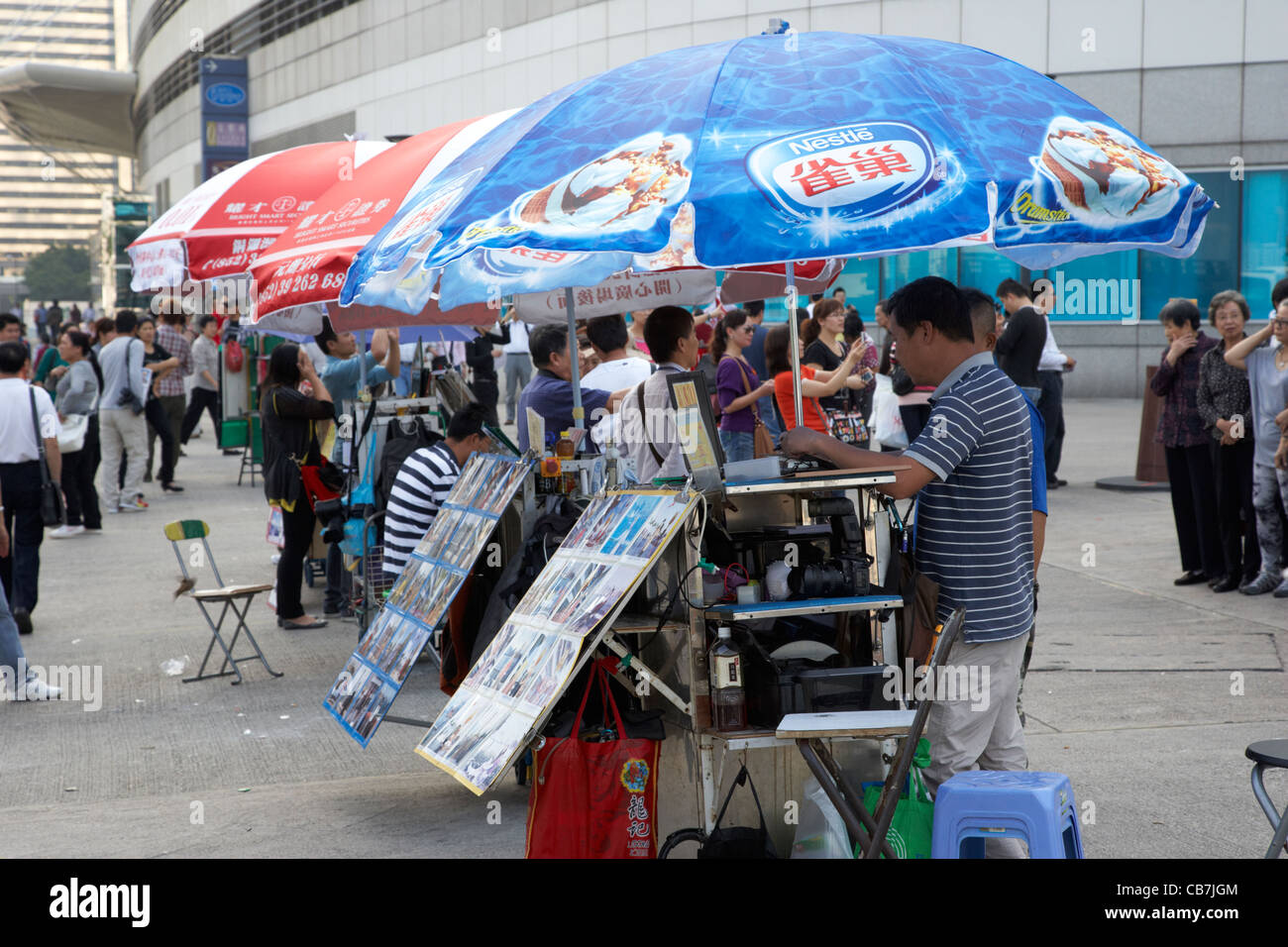 rows of professional event photographers in golden bauhinia square hong kong island, hksar, china Stock Photo