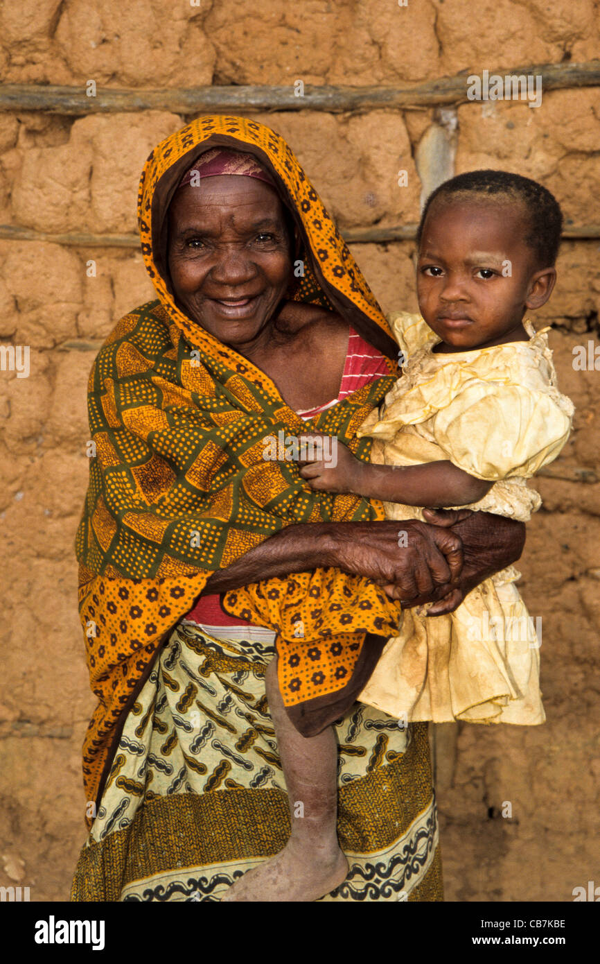 Grandmother helps with parental care of her grandchild, Lushoto Usambara Mountains Tanzania Stock Photo