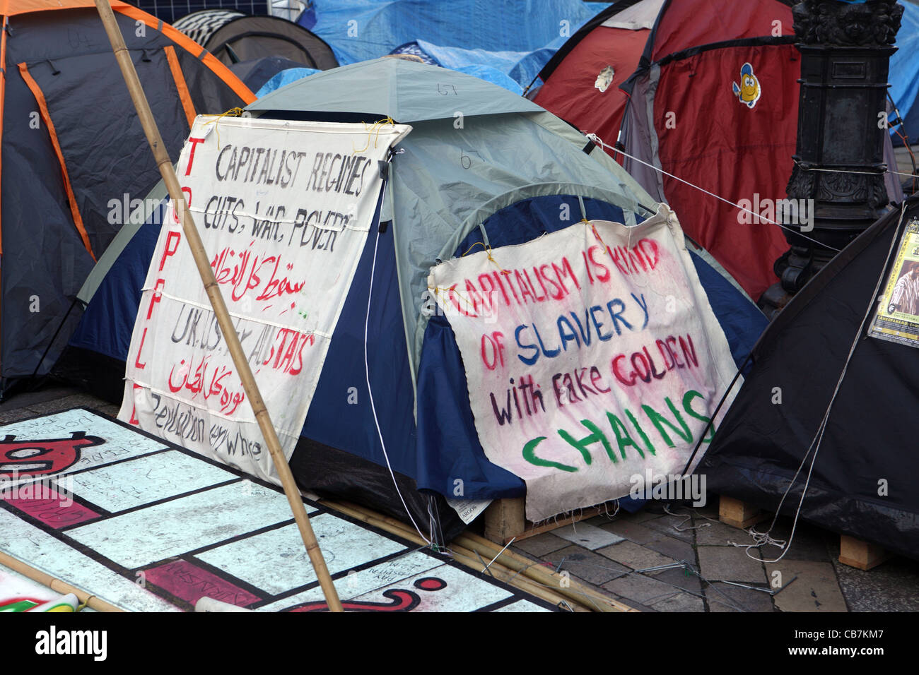 image of one of the many tents at the Occupy London protest St Paul's London, UK - anti capitalism slogans Stock Photo