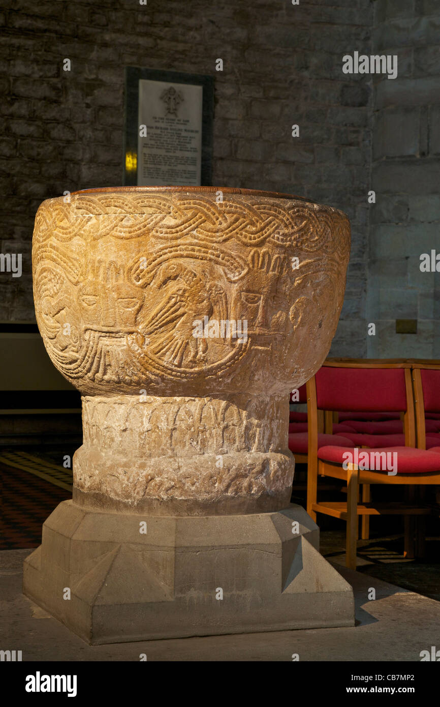 12th century Norman font, interior of Brecon Cathedral,  Powys, Wales, Cymru, UK, United Kingdom, GB, Great Britain, British Isl Stock Photo