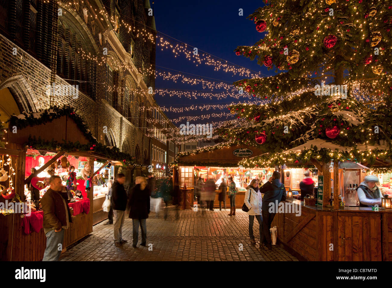 Illuminated booths and stands at Christmas market in the Hanseatic City of Lübeck, Germany Stock Photo