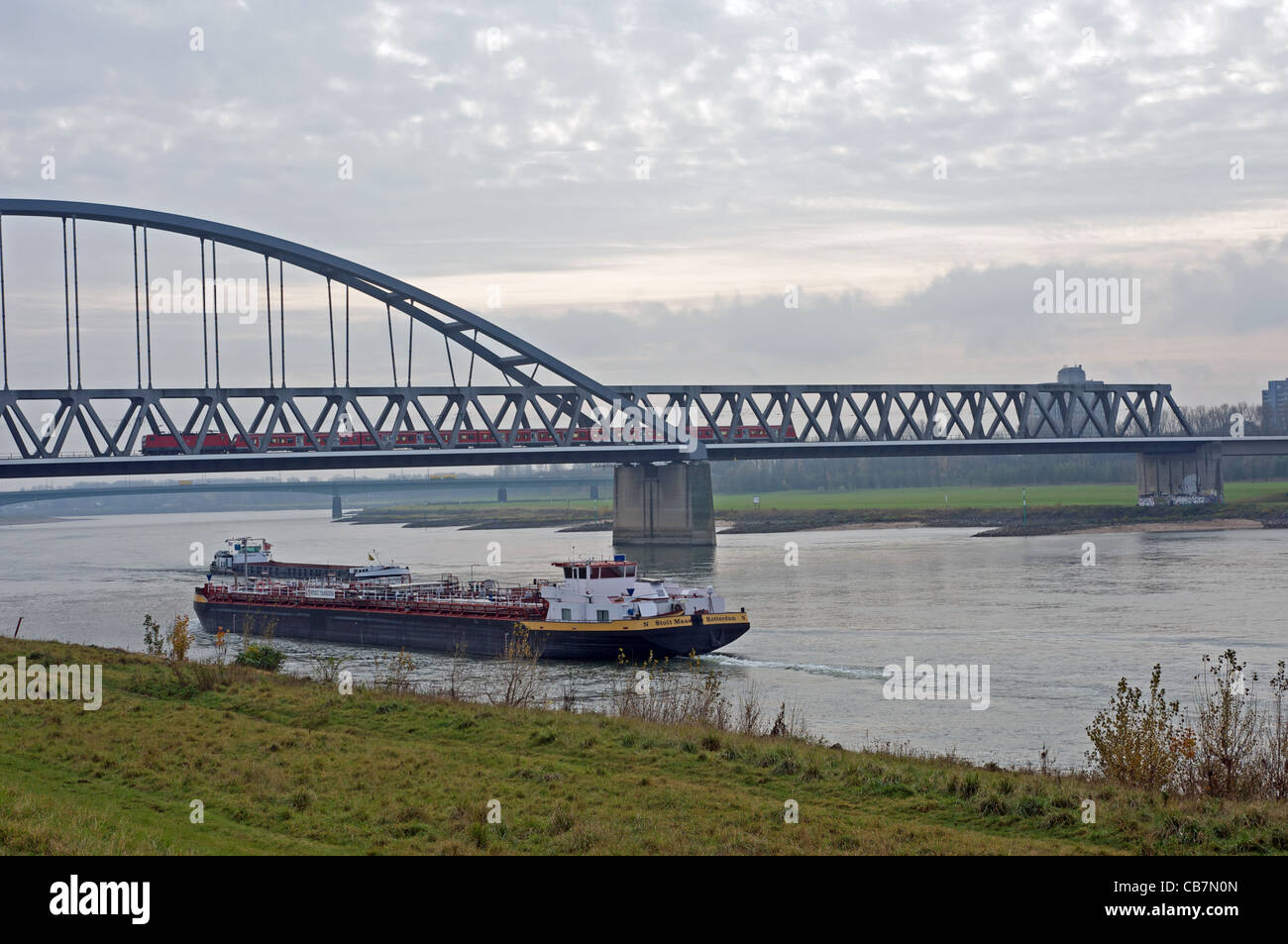 Commercial barges sailing on river Rhine, Dusseldorf, Germany. Stock Photo