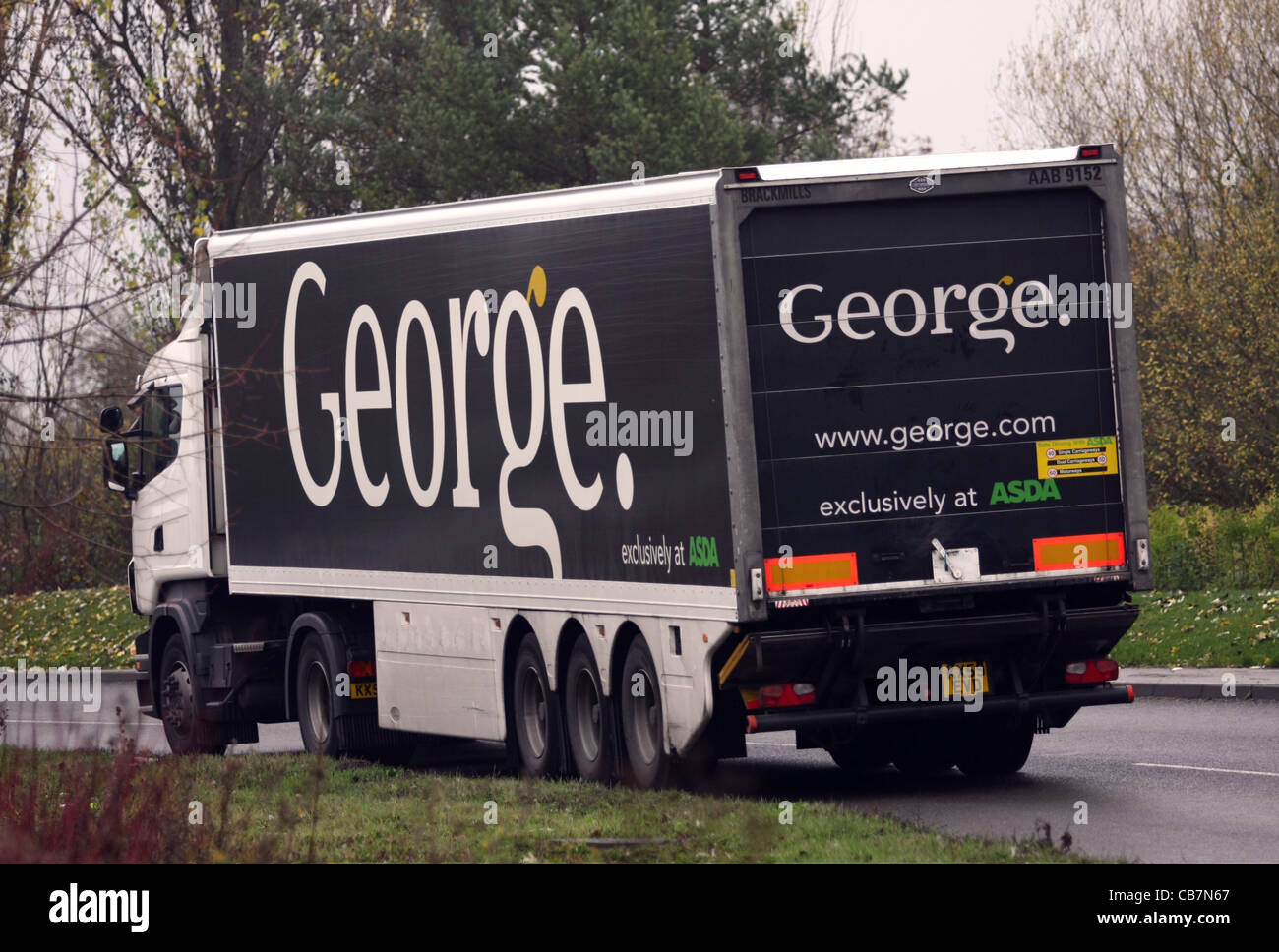 a truck traveling along a rural road on a dull autumn day in England Stock Photo