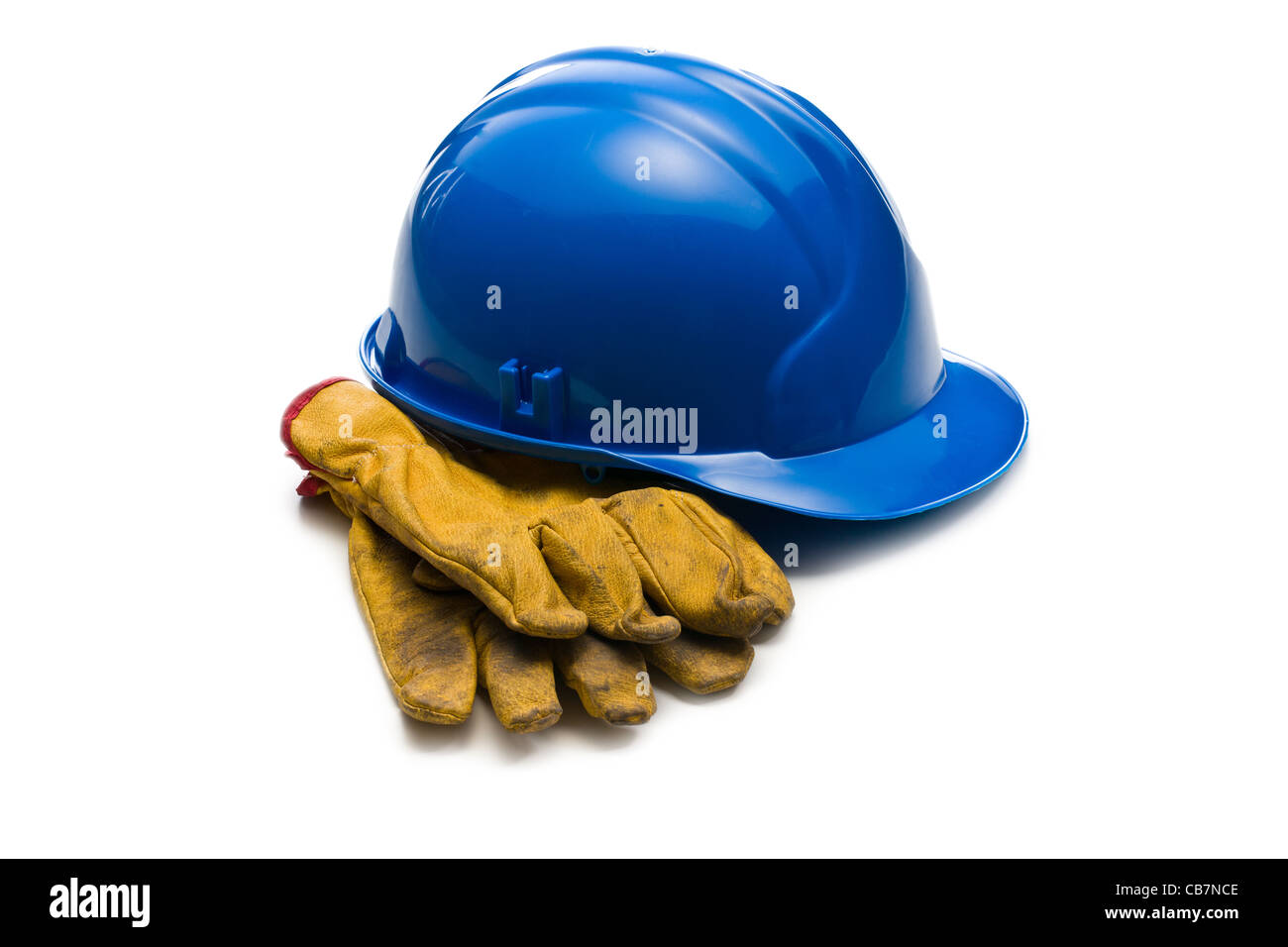 the blue hardhat and leather working gloves Stock Photo
