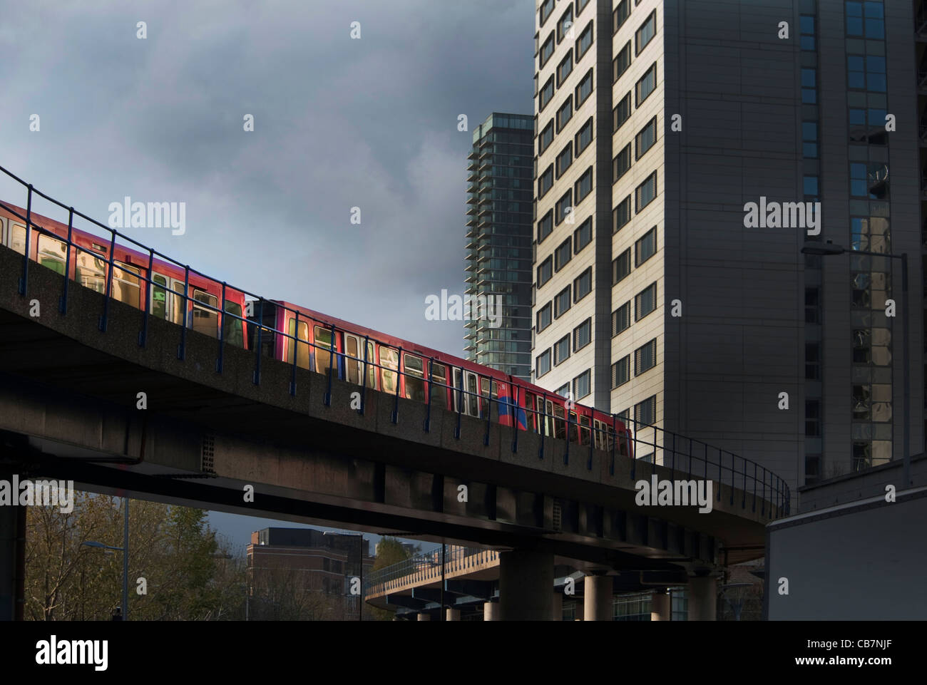 Docklands light railway, an unmanned transport train in London, crossing a bridge near South Quay station Stock Photo