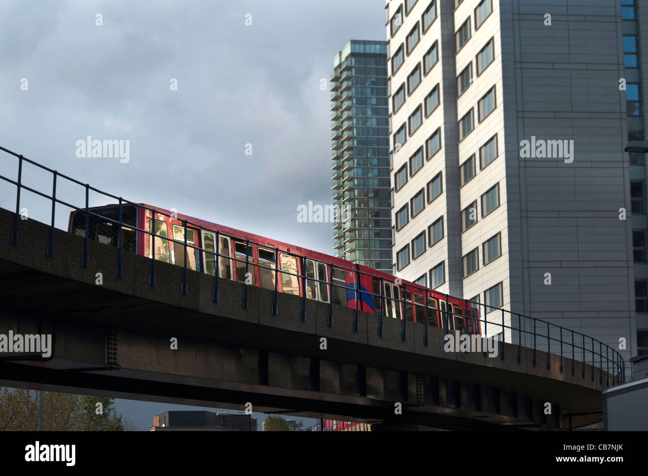 Docklands light railway, an unmanned transport train in London, crossing a bridge near South Quay station Stock Photo
