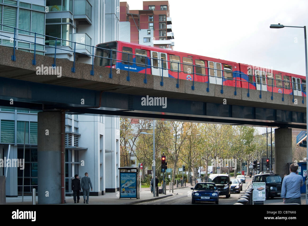 Docklands light railway, an unmanned transport train in London, crossing a bridge near South Quay station Stock Photo