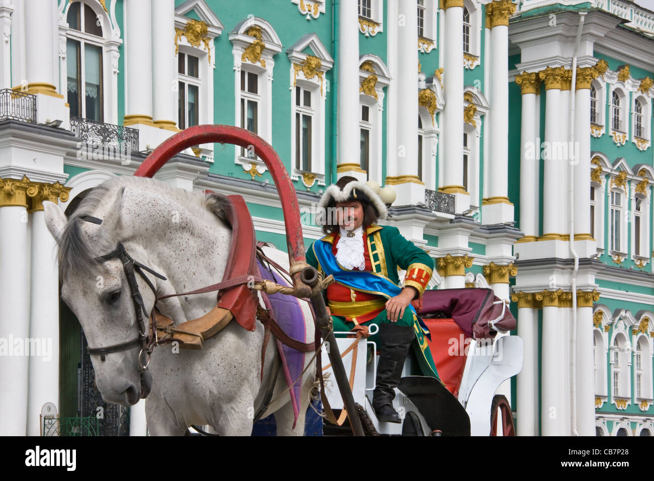 Horse carriage and driver in Tsar era attire in front of Winter Palace