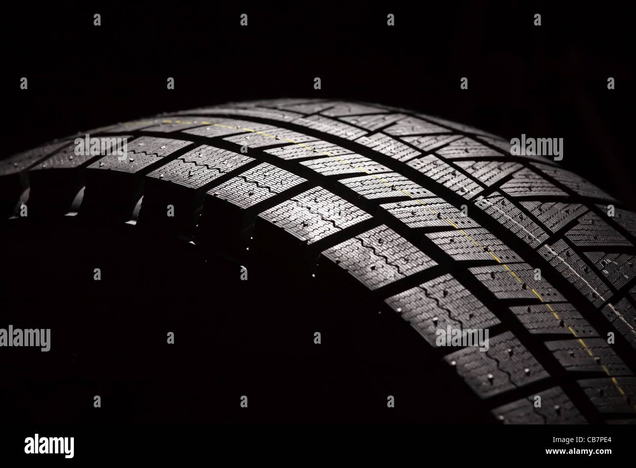 Part of brand new car tyre. Horizontal composition. Stock Photo