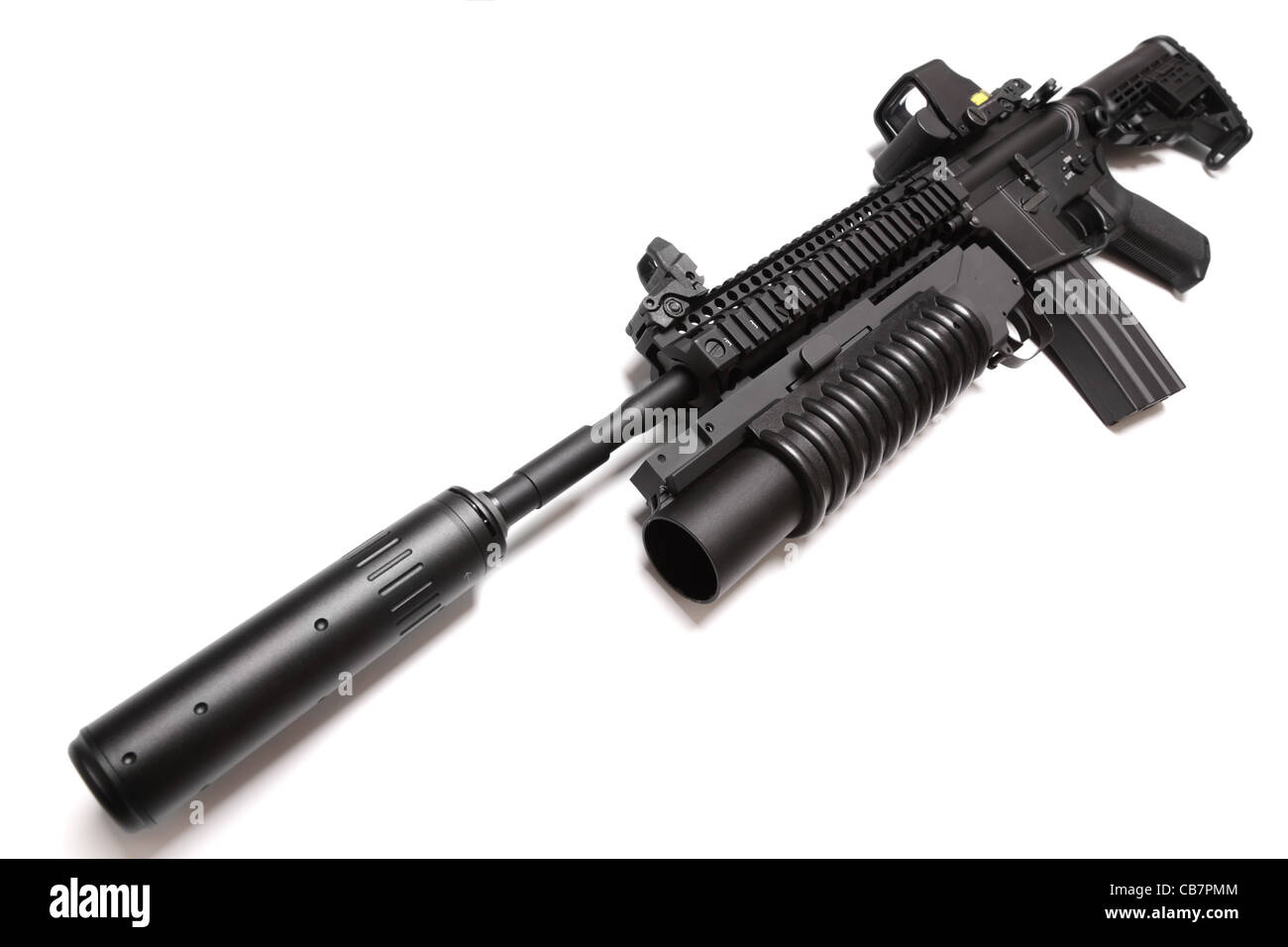 SpecOps M4A1 assault carbine with silencer (sound supressor) and M203 grenade launcher mounted onto the RIS forend. Stock Photo