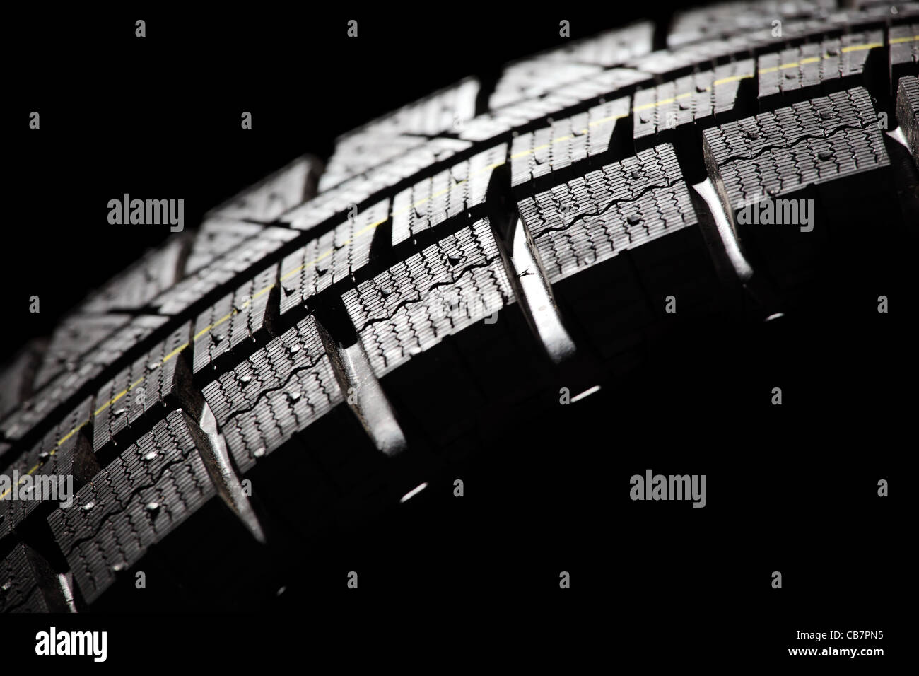 Part of brand new car tyre close-up. Horizontal composition. Stock Photo