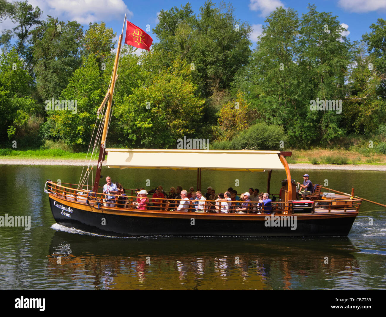Dordogne River tourist boat, France - at La Roque Gageac - with tourists on a sightseeing trip in summer Stock Photo