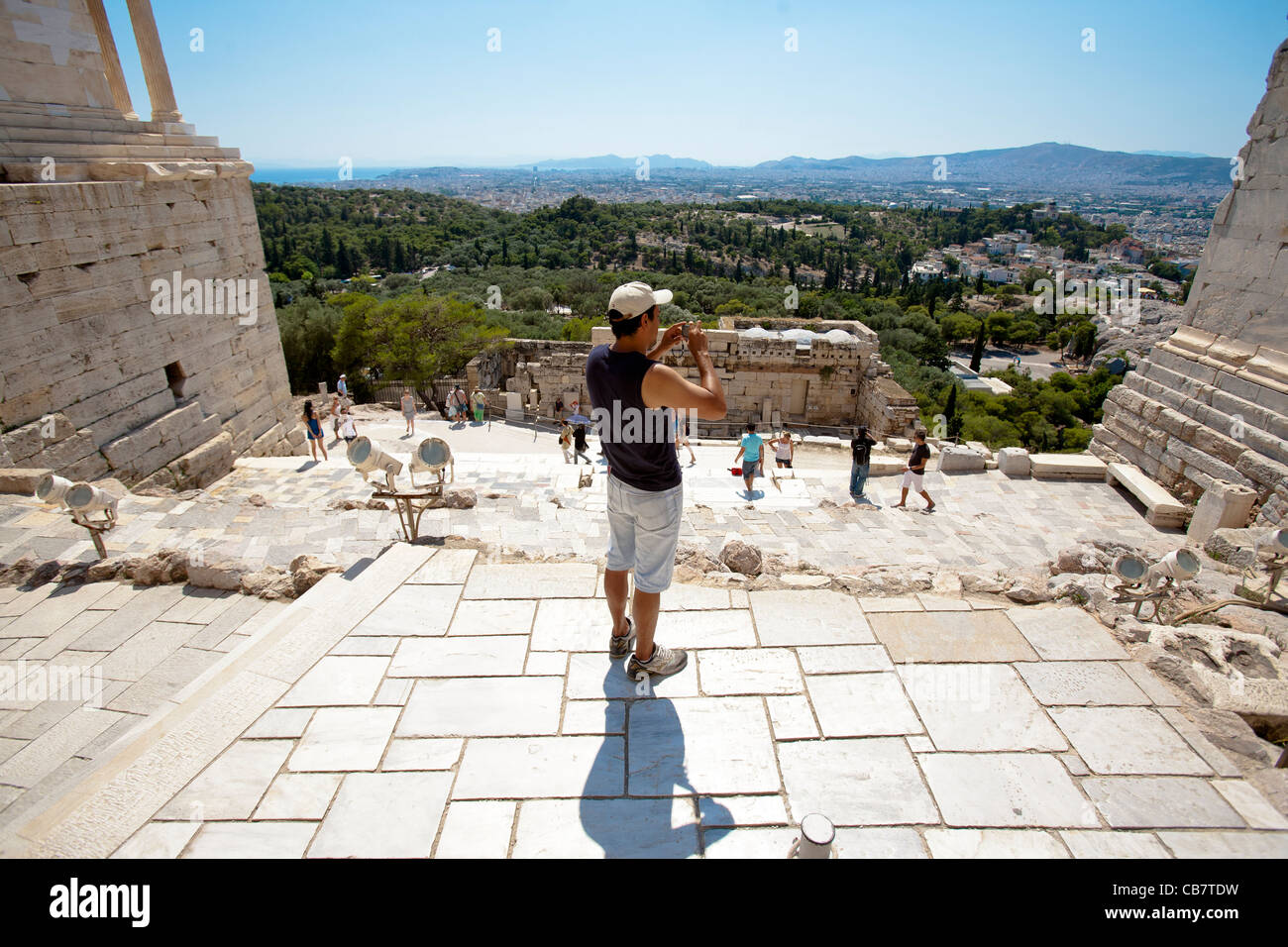 Travel and architecture shots from Greece - A tourist taking a photograph at the Akropolis entrance Stock Photo