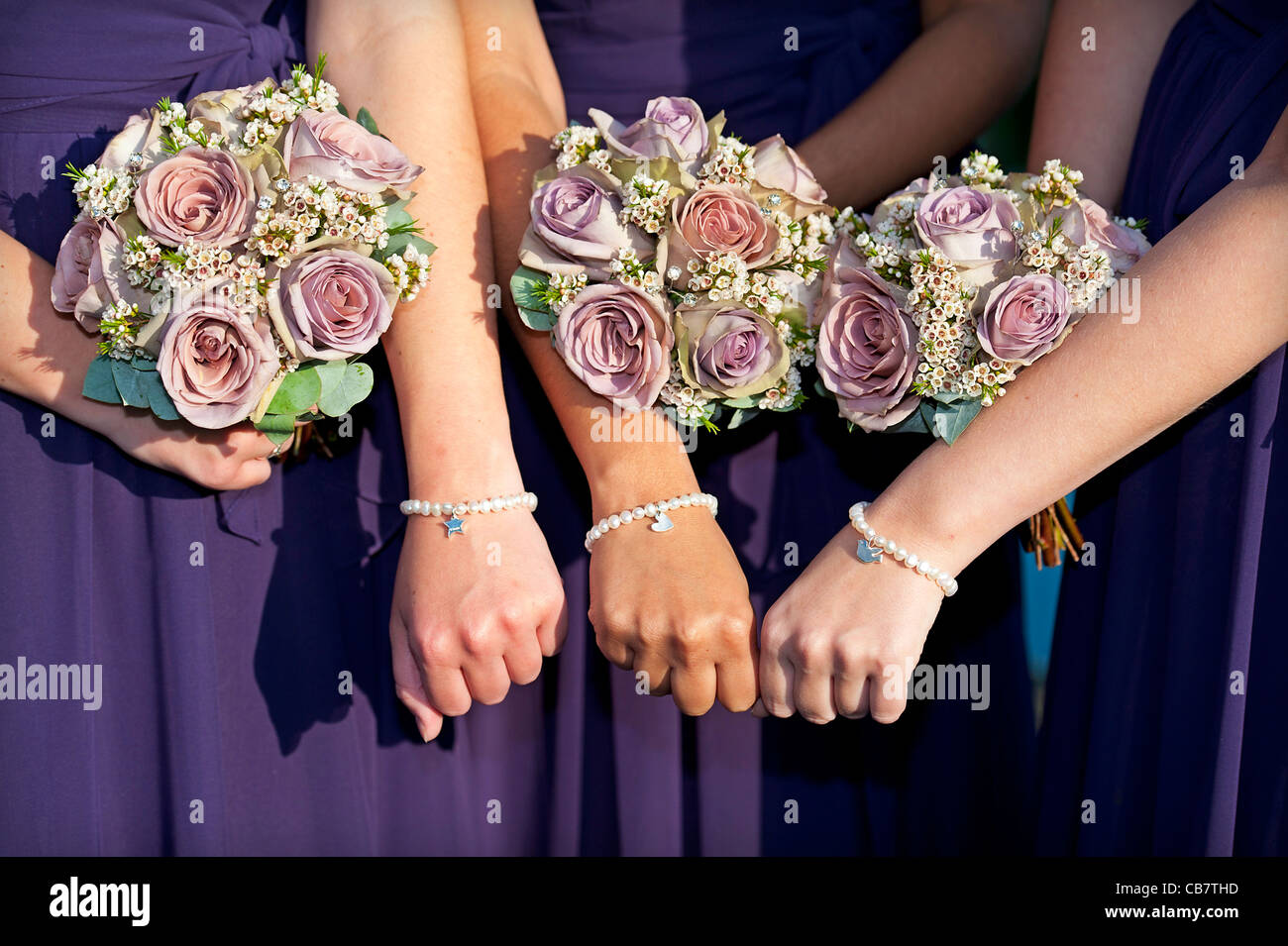 Bridesmaids holding one flower Clearance