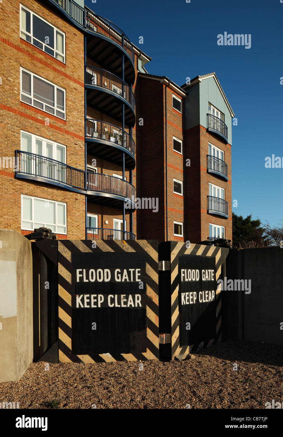 Thameside apartments protected with floodgates. Stock Photo