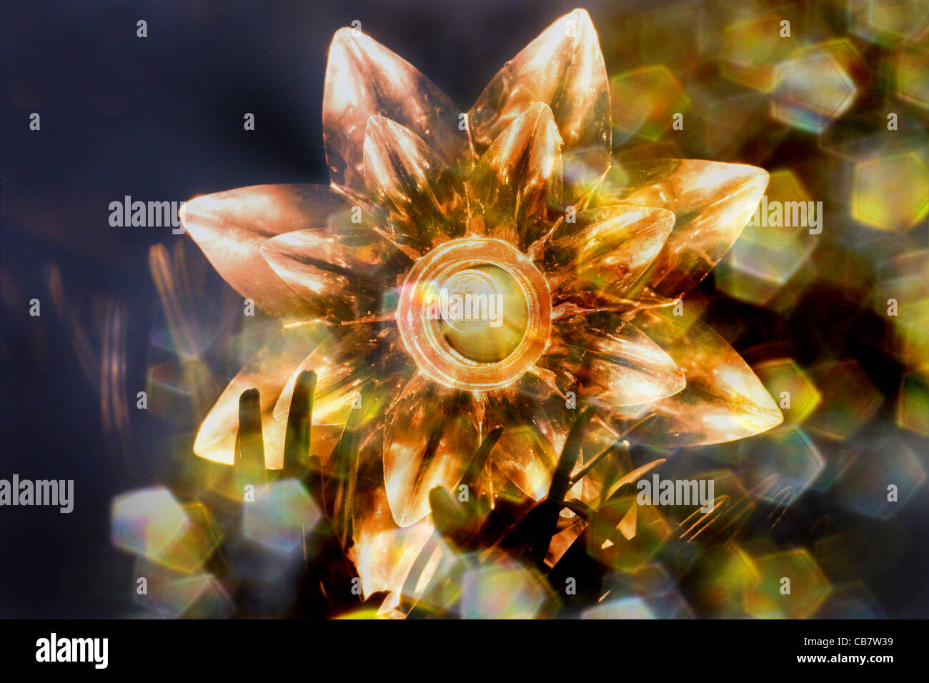 Flower shaped Christmas decoration with lights in christmas tree Stock