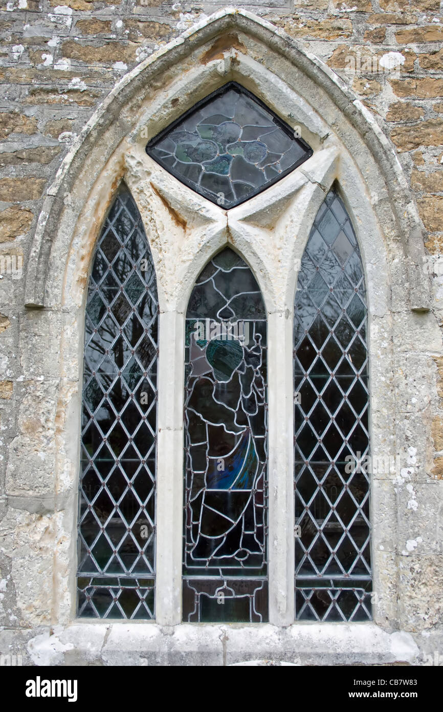 Very old and faded stainedglass window in St Ann's church, Weymouth