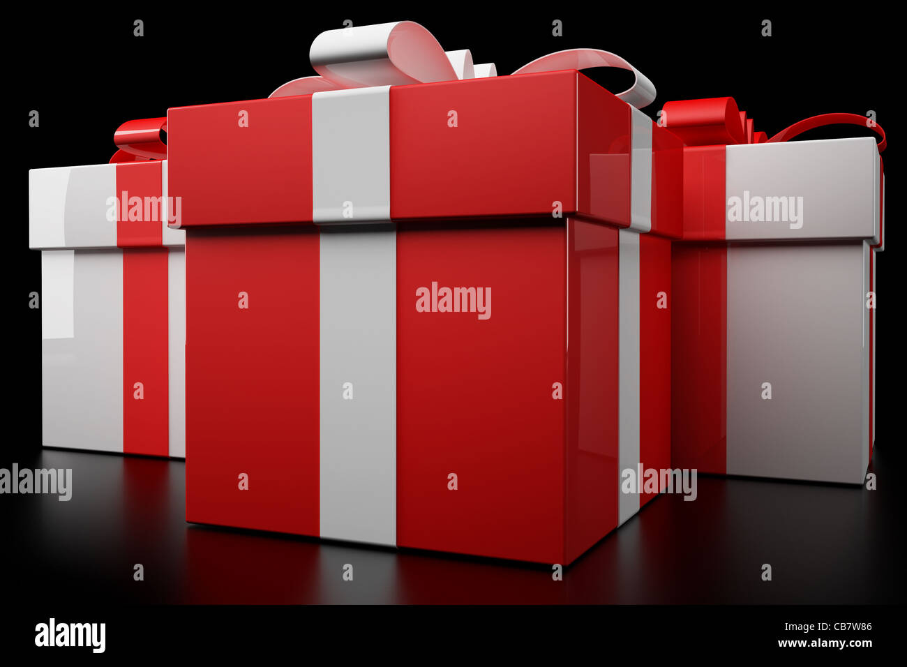 Gift box red and white on black background Stock Photo - Alamy