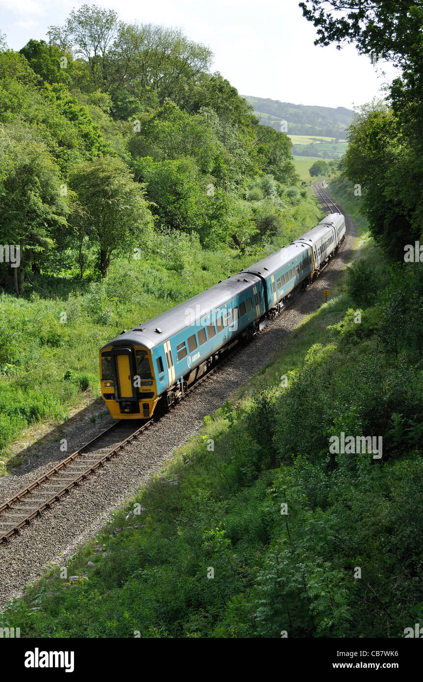 An Arriva Trains Wales Class 158 diesel multiple unit on a service from Aberystwyth and Pwllheli to Shrewsbury near Welshpool Stock Photo