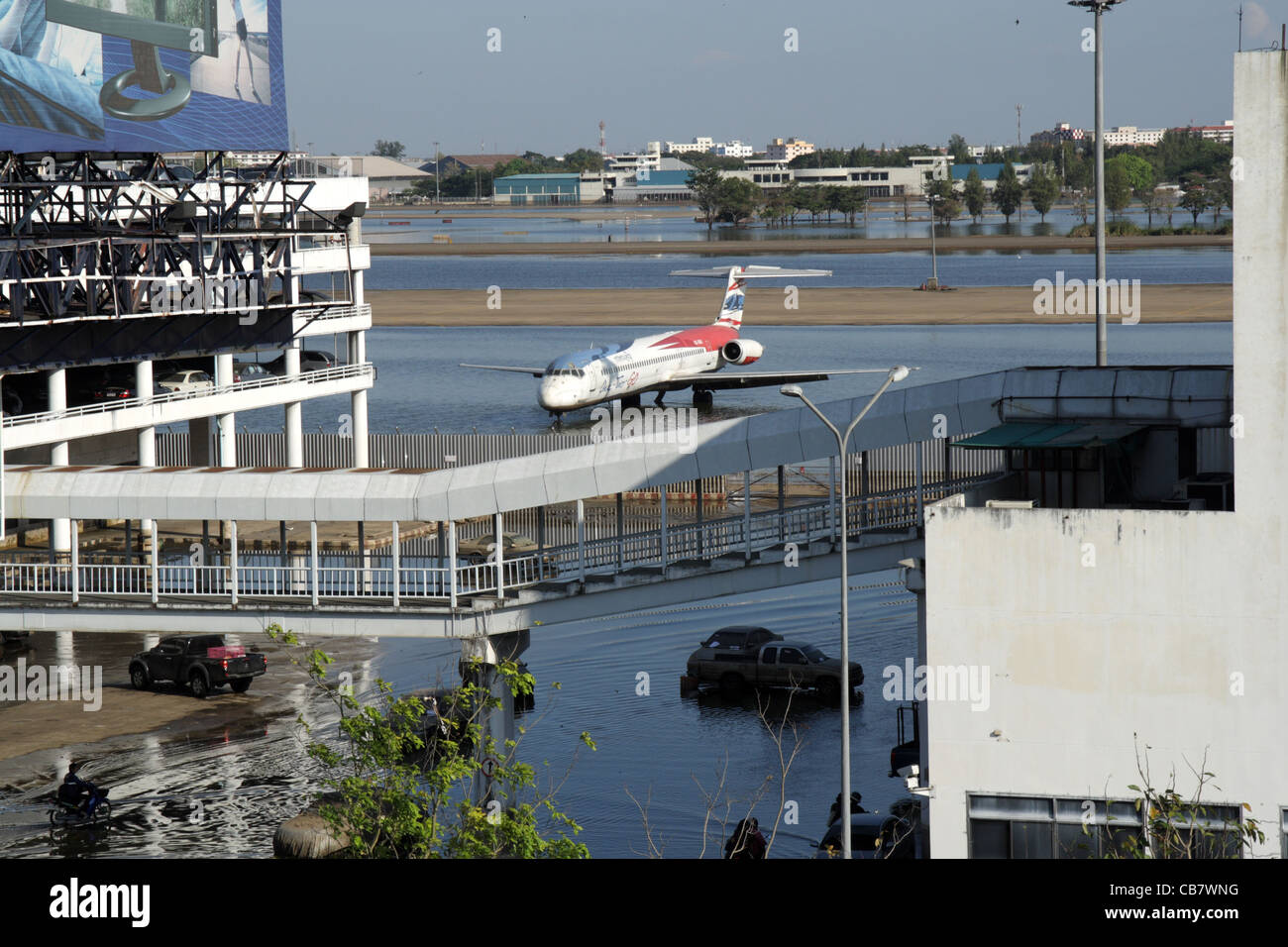 Planes sit on a flooded tarmac at the Don Muang domestic airport Stock Photo