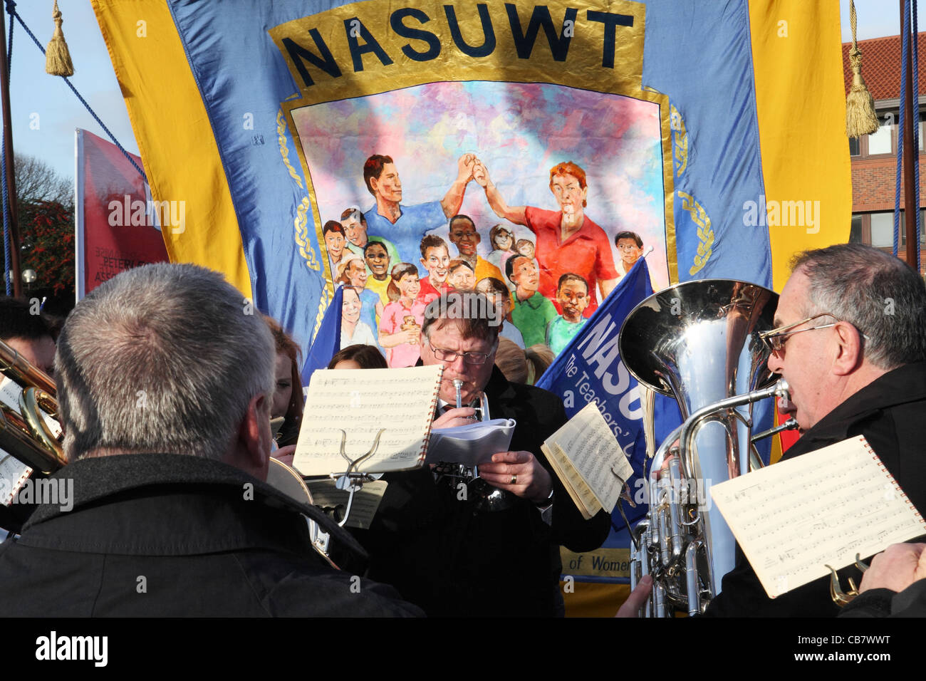 Brass band plays before NASUWT banner, TUC day of action, Gateshead, north east England, UK Stock Photo