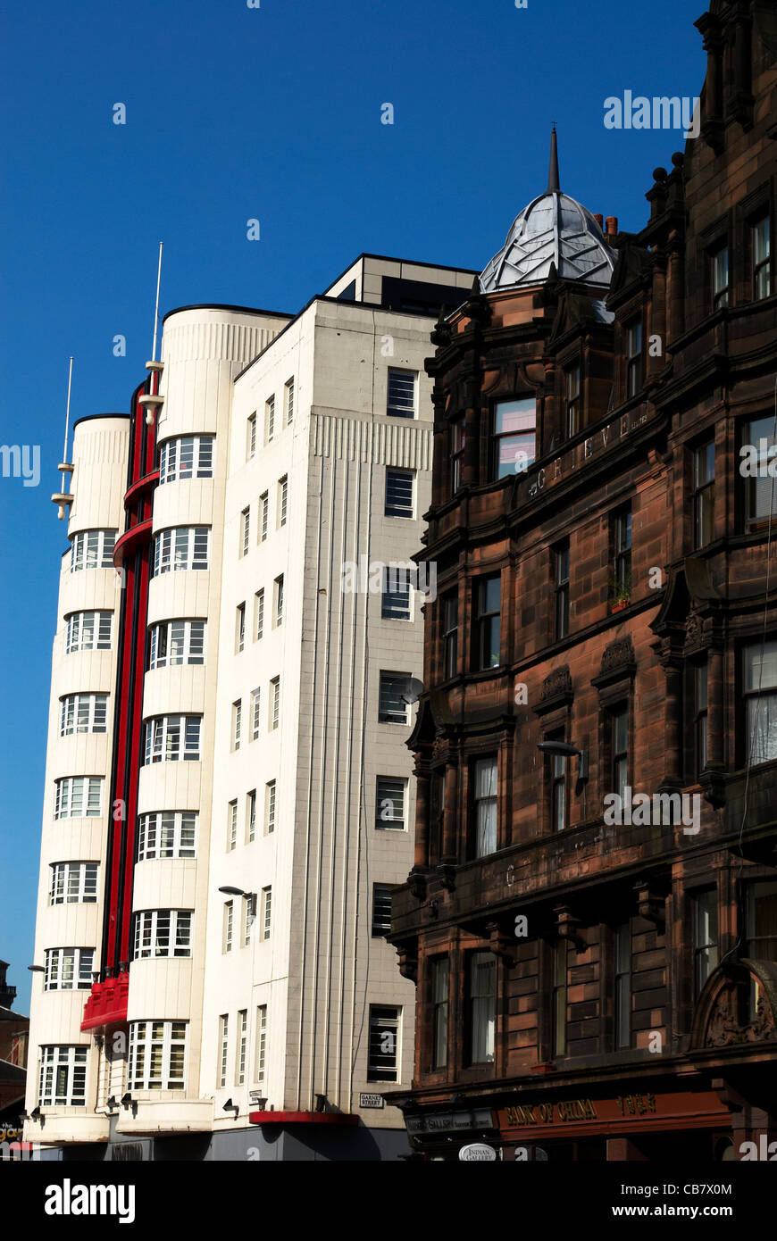 Art Deco Building  contrasts with Victorian building Glasgow Stock Photo