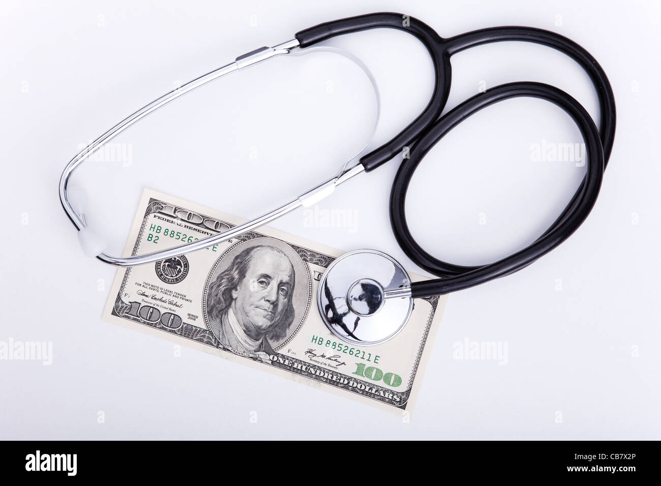 Health cost concept with a stethoscope and money Stock Photo Alamy