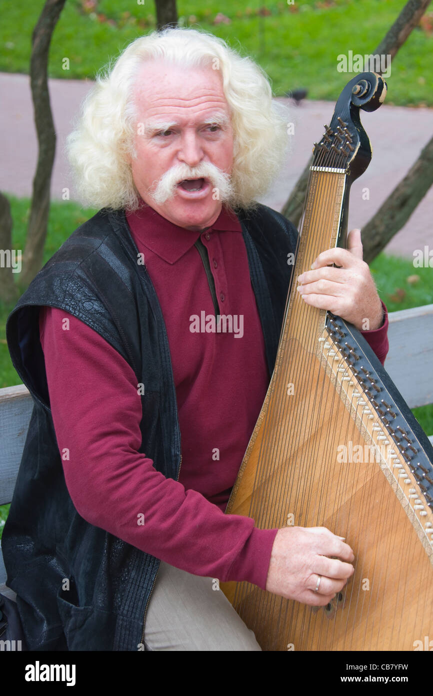 Man playing harp, Kiev, Ukraine Stock Photo
