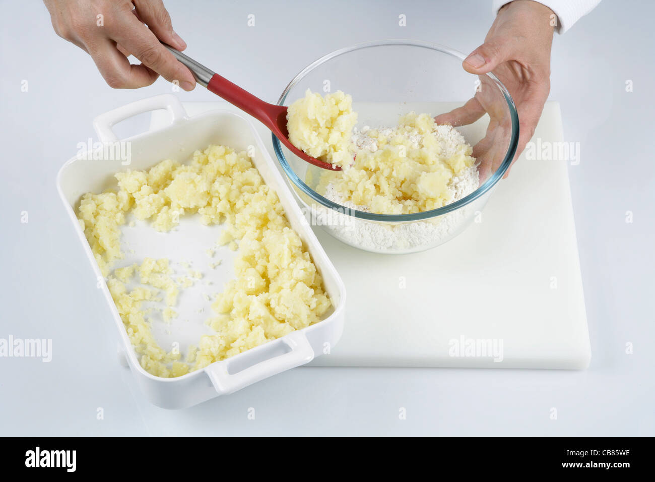 Mixing mashed potato with flour and egg Stock Photo Alamy